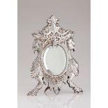 A table top mirrorFrench silver Repousse decoration frame with garlands, foliage, winglets and