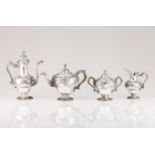 A tea and coffee setPortuguese silver Pear shaped body of profuse rocaille reliefs decoration and