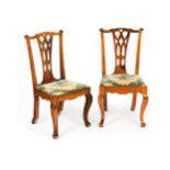 A pair of Chippendale chairsWalnut Of pierced backs and cabriole legs with protruding knees