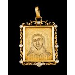 A pendantGold Engraved with Christ's Head framed by volutes frieze set with 10 antique brilliant cut