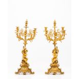 A pair of Louis XV style six branch candelabraReliefs and chiselled decoration gilt bronze Putti