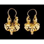 A pair of patterned loop earringsPortuguese gold Reliefs decoration to both faces Dragon hallmark