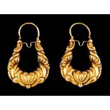 A pair of patterned loop earringsPortuguese gold, 19th century Foliage motifs and winglets