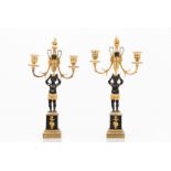 A pair of Directoire candelabraGilt bronze with patination Two branches and shafts with urns holding
