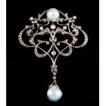 An Art Nouveau brooch/pendantGold and platinum Scalloped decoration of stylised foliage motifs and