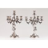 A pair of five branch candelabraPortuguese silver Profuse rococo decoration Shaft, branches, drip