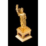 A pendantGold The Statue of Liberty set with blue and red stones Dragon hallmark 800/1000 (1938-