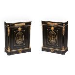 A pair of Napoleon III low cupboards Ebonised wood Gilt bronze mounts and brass inlaid elements