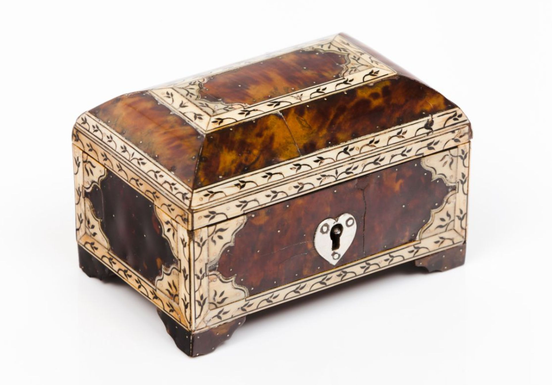 A small casketTortoiseshell coated wood with engraved inlaid ivory decoration Silver hardware of