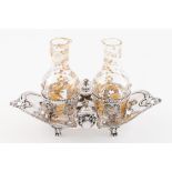 A Louis XVI cruet setFrench silver Boat shaped stand of beaded friezes, pierced medallions of