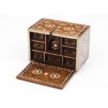 A fall-front cabinetExotic timber Inlaid mother-of-pearl decoration Seven inner drawers and