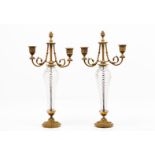 A pair of Napoleon III two branch candelabraGilt bronze Reliefs decoration with spiralled glass