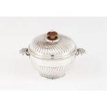 A sugar bowlPortuguese silver Circular shaped of spiralled fluting, flower shaped handles and turned