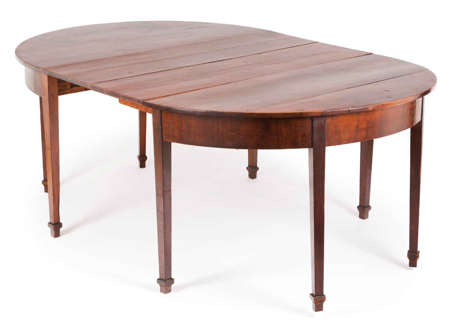 A George III style dining tableSolid and veneered Brazilian rosewood On eight feet (with two