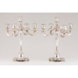 A pair of five branch candelabraPortuguese silver Four faces turned shaft of engraved friezes and
