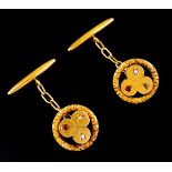 A pair of cufflinksGold Shamrock decoration set with ruby and micro pearls Tiger hallmark 800/