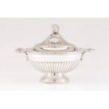 A tureen with coverPortuguese silver Circular shaped, part fluted body and cover of gadrooned frieze
