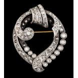 A brooch/pendantGold and silver Stylised heart with top interlaced volute set with antique cut and