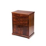 A Louis Phillipe toilette cupboardMahogany and burr mahogany Stone lined interior with mirror Two