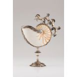 A nautilus shellSilver mounted Moulded and engraved foliage friezes and sculpted horses Tall