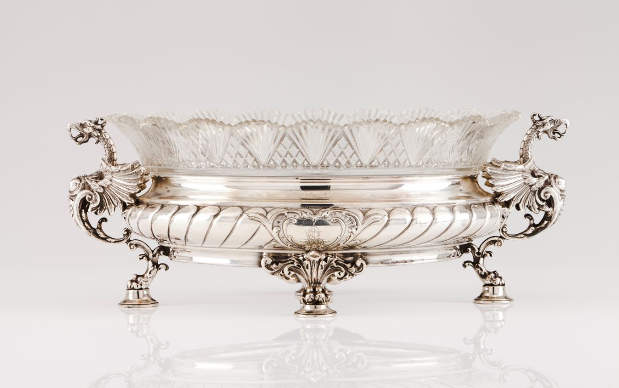 A centrepieceSilver and cut crystal Crystal bowl resting on oval, part gadrooned stand of two