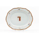 A scalloped armorial serving platter