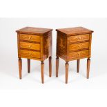 A pair of bedside tables