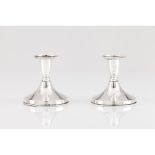 A pair of low candlesticks