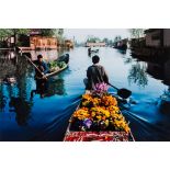 Steve McCurry (b. 1950)"Merchants paddle boats", 1998