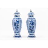 A pair of Kangxi vases with covers