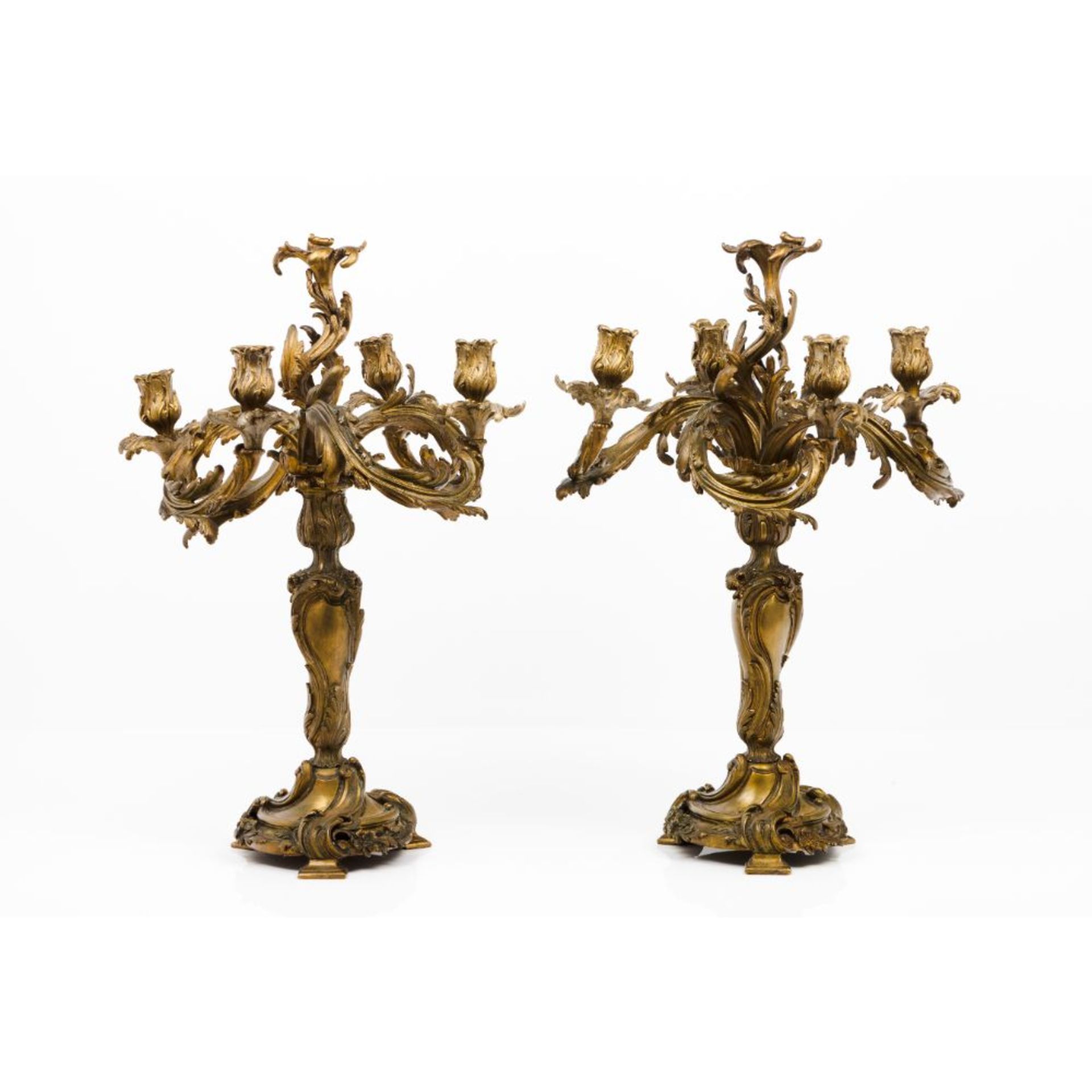 A pair of Louis XV four branch candelabra