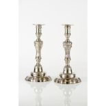 A pair of rococo style candles sticks