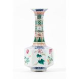 A rare underglaze blue and Famille Rose enamelled 'Floral' faceted bottle vase