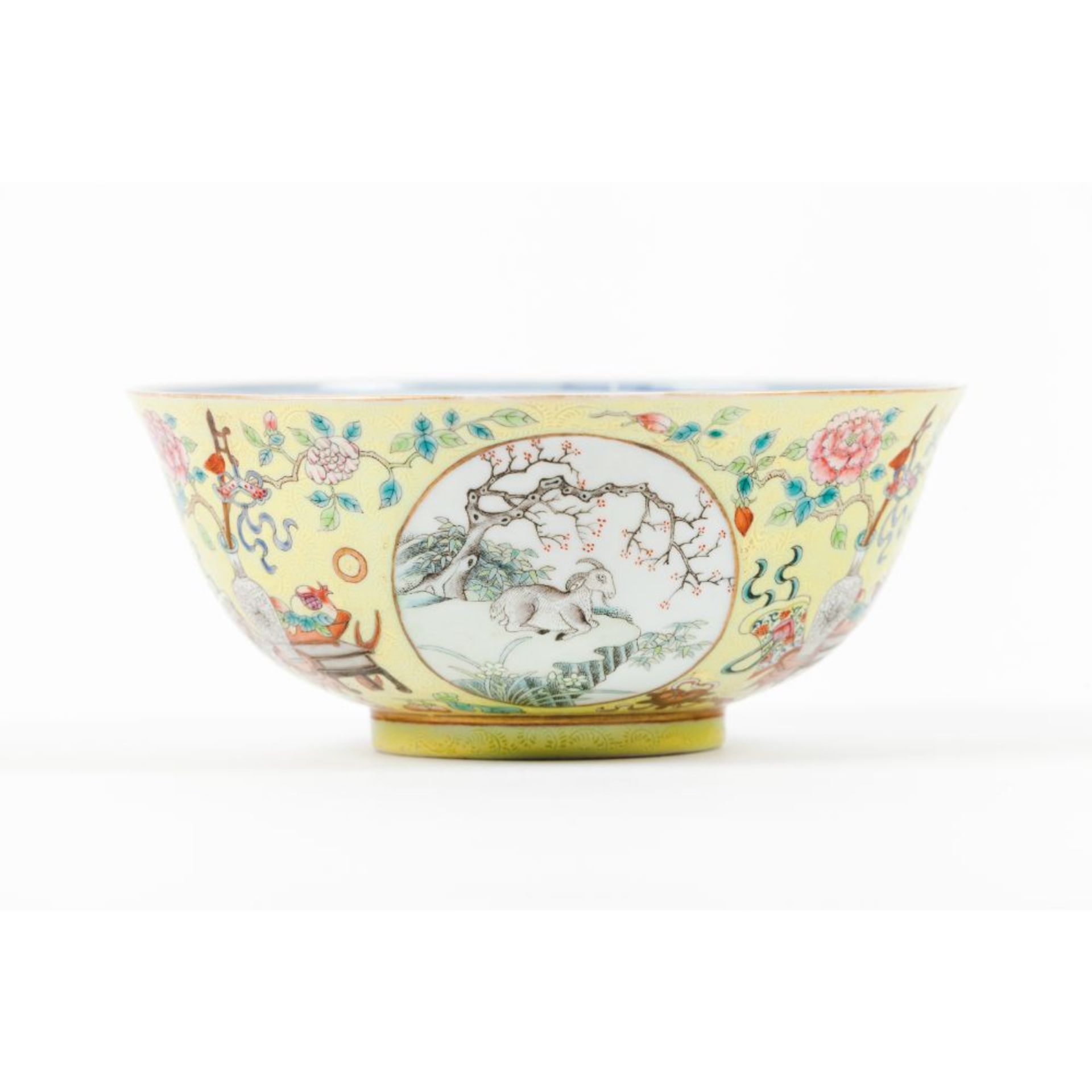 A Famille Rose yellow-ground 'ram' medallion bowl