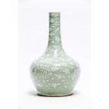 A celadon-glazed slip-decorated bottle vase