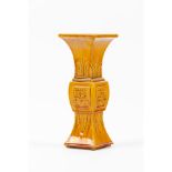 A yellow-glazed archaistic beaker vase