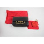 Two Items of Carolina Herrera products to Include 1x Leather Heart For Hope Bag Charm and 1x Medium