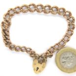 9ct gold bracelet of graduated links with padlock clasp and guard chain open, L: 17 cm, 18.3g. P&P
