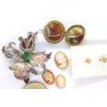 A 19th century pinchbeck brooch set with two circular panels of agate, a further costume brooch, a