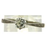 18ct white gold and platinum solitaire diamond ring with diamond set shoulders, size N/O, 1.9g. P&