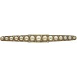 18ct white gold brooch set with fifteen graduated pearls and twenty eight diamonds, L: 62 mm, 5.