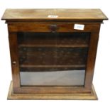 20th Century mahogany single door display cabinet of small proportions with two internal shelves, 40