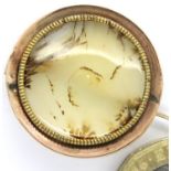 19th century circular domed panel of moss agate set into a presumed 9ct gold brooch mount (