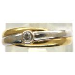 18ct white and yellow gold band ring set with a single diamond size J/K, 1.8g. P&P Group 1 (£14+