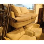 Modern leather and upholstered three piece suit comprising two seater settee and two single