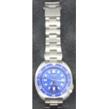 AKIO; gents new old stock automatic wristwatch, having blue dial and steel bracelet, boxed.