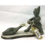 Inuit stone carving of a man and a fish, L: 22 cm, one foot loose, chips throughout. P&P Group 2 (£