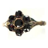 Unmarked 9ct gold garnet set ring, size N/O, 1.3g. P&P Group 1 (£14+VAT for the first lot and £1+VAT