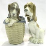 Two Lladro dogs, one in a barrel, largest H: 19 cm. No cracks chips or visible restoration. P&P