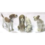 Four Lladro dogs, tallest H: 90 mm. No cracks, chips or visible restoration. P&P Group 2 (£18+VAT